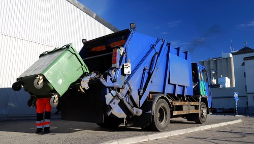Residents utilizing recycling services in Woolwich
